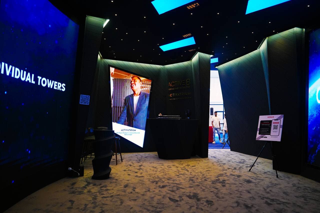 Projection mapping onto a curved exhibition stall canopy at Auto Expo