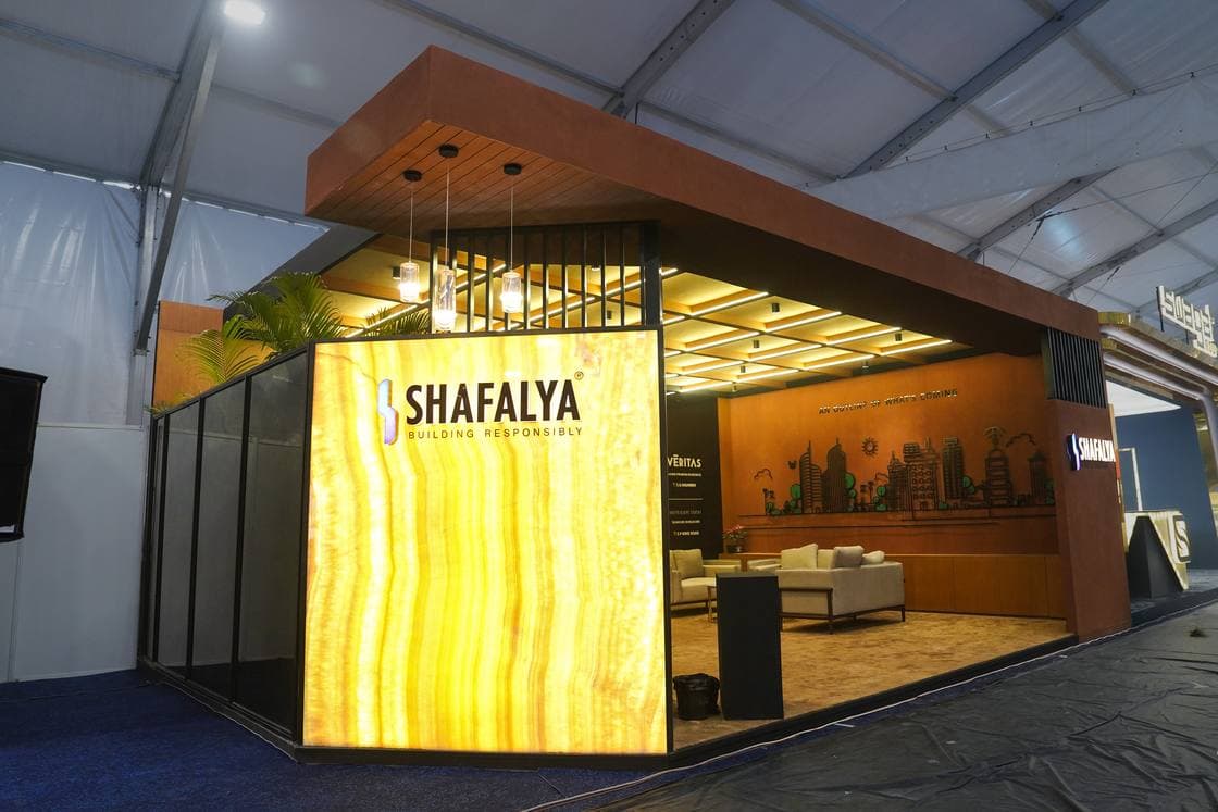 Large-format custom booth with structural steel and premium finish materials